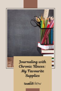 A pile of notebooks are placed in front of a blackboard background. There's a cup with pens, scissors, and pencils on the notebooks. The title of the post is Jounraling and Chronic Illness: My Favourite Supplies.