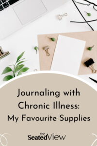 A white background with a small branch from a plant, a few suppllies, a pair of glasses and the corner of a laptop. The title of the post is Jounraling and Chronic Illness: My Favourite Supplies.