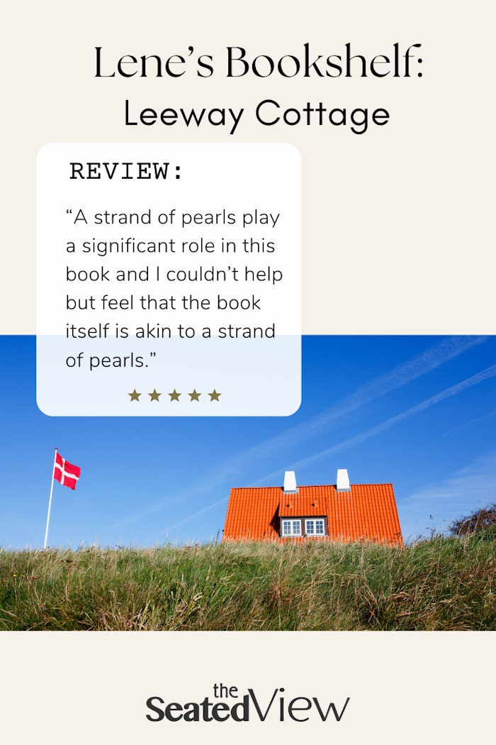 Red-tiled roof of a cottage peeks up over the grass on dunes. There's An inset bok: "Review - A strand of pearls play a significant role in this book and I couldn’t help but feel that the book itself is akin to a strand of pearls." 5 stars