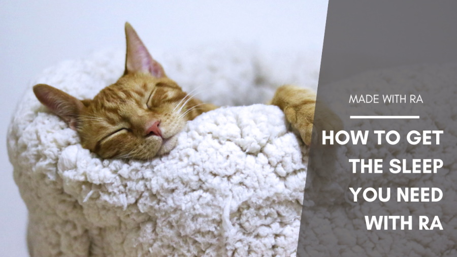 Title graphic showing an orange tabby (cat) asleep in a comfy basket. Text: Made With RA: How to Get The Sleep You Need With RA.